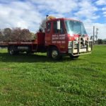 Large picture of the Bent and Broke Towing Truck sitting in a paddock