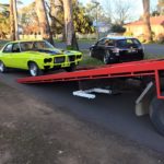 A picture of a Lime green Holden GTS on the Bent and Broke Towing truck